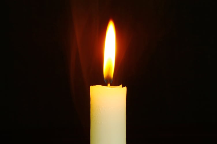 A candle lit at a church. 