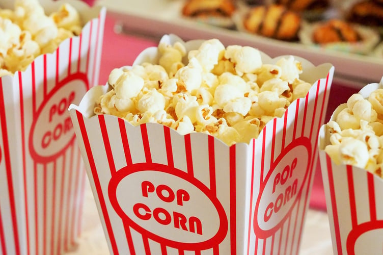 Popcorn waiting to be eaten at the cinema. 