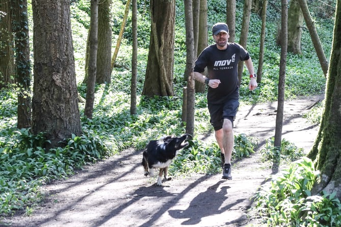 Jim Plunkett-Cole running with his dog, Flow. 