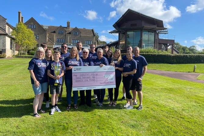 Frank Blacker’s family, including his wife, daughters, their husbands and their children all attended Dorothy House, Winsley, to present the cheque. 