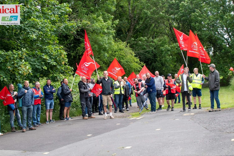 Sun Chemical UK employees from Midsomer Norton strike outside the factory. 