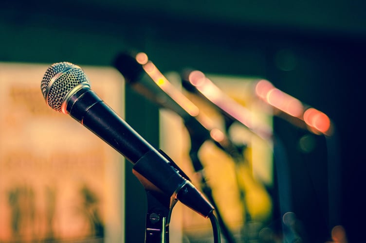 Singing - Microphones lined up ready for singers. 