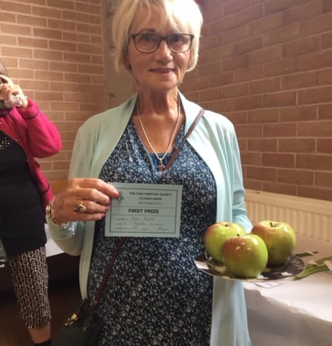 Photograph shows Joan Knott, who won first prize for her apples.