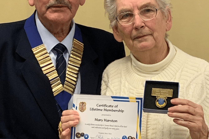 Norwest President, Merv Ashman, presenting Mary Harston with her Life Membership award.
