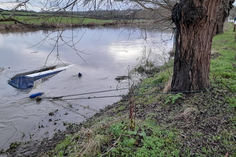 A boat, attached to a tree in Saltford, has sunk in the River Avon. 