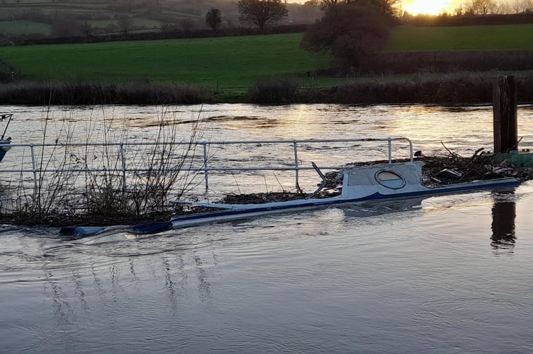 A sunken boat in the River Avon, Saltford. 