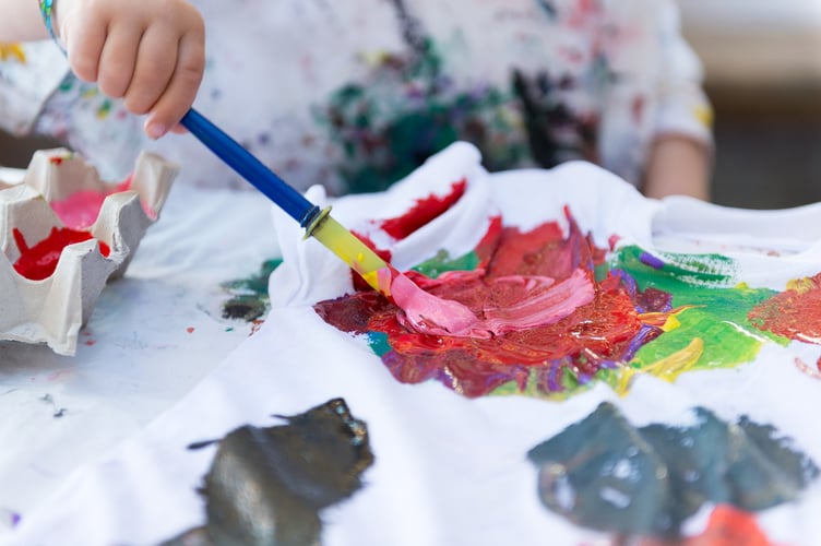 Children painting and getting creative.