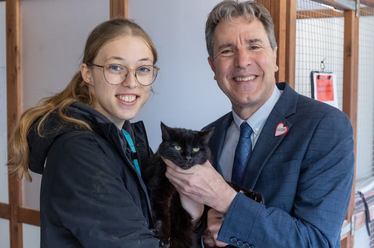 Mayor Norris at Bath College with Tosca the black cat and student Anna Colbourne.