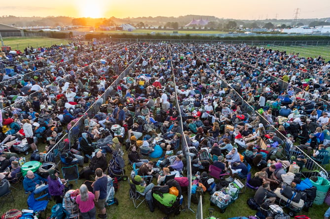 Large queues ahead of the opening of Glastonbury Festival. Glastonbury, Somerset. June 26 2024.  For the next five days the festival will become the most densely populated place on earth.