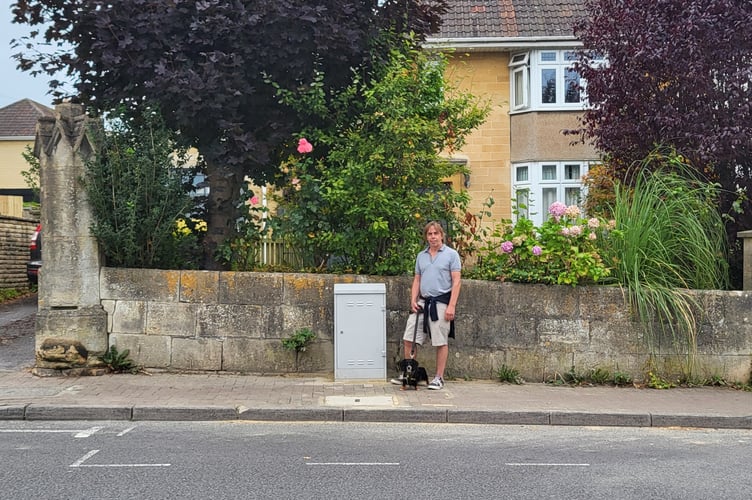 Sean Alexander with the 'eyesore' telecoms box (Image: Sean Alexander) 