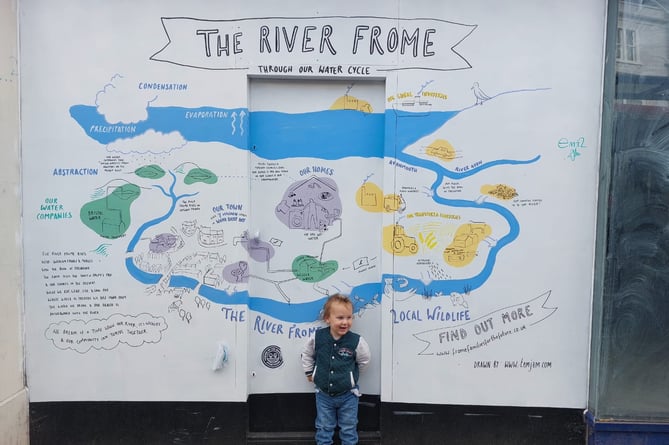 Two-year-old Luca with the mural