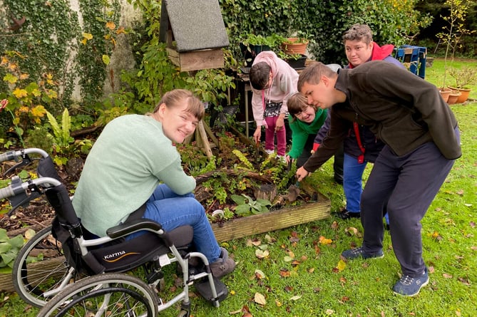 SWALLOW members planting the crocus bulbs