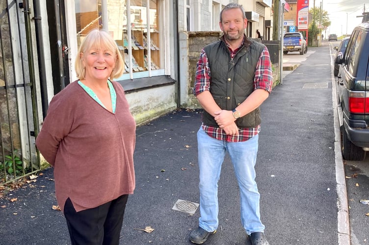 Cllr Karen Walker and Cllr Gavin Heathcote, in Bath Road, Peasedown St John, inspecting the newly refurbished pavements