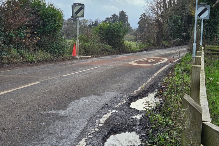 Large potholes visible along the B3355, on the narrow bend by the Rugby Club.