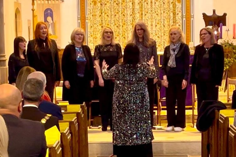 The Jenny Peplow Choir leads the festive sing-alongs at the Community Christmas Carol Service, hosted by the Rotary Club of Midsomer Norton & Radstock at St. John the Baptist Church.