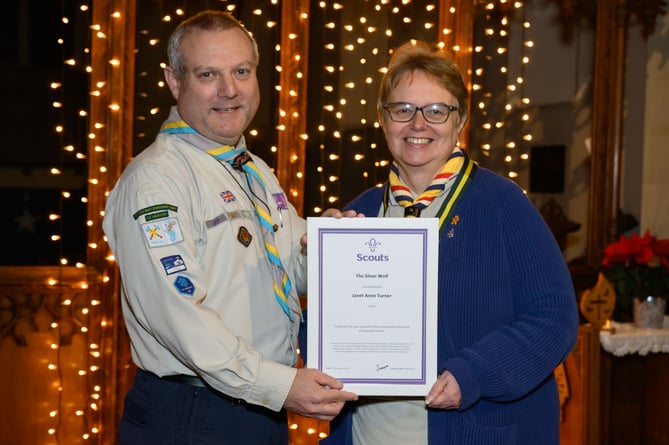 Graham Bush from Wansdyke District Scouts presents Janet Turner with her Silver Wolf award