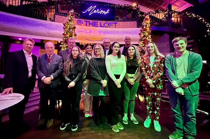 BBC Radio Somerset’s Simon Parkin, Deputy Lieutenant Robert Drewett, Sound Vision CEO Dom Chambers, Raven, Evie, Trainer Maggie Harding, High Sheriff Rob Beckley, Clara, Sound Vision chair of trustees Phil Gibbons, Alice, Rosie Smith and Jamie Skinner.