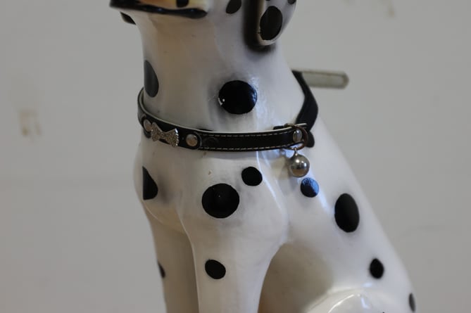 A figurine of a spotted dog is among the items featured in an online gallery of suspected stolen property.