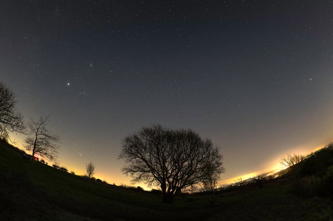 "The planetary parade was photographed on 2nd January. It captures six planets of the solar system and the Moon. This was three wide-angle shots generated as a panorama.    A talented photographer has shown off his stargazing images taken so far this year. Josh Dury, 27, captures cosmic wonders from various locations around the UK. His work this January includes an incredible picture show both the Moon and Venus, and another featuring six planets and the Moon.