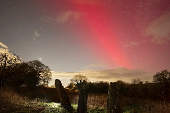 This photograph was captured from the Harolds Stones in South Wales on New Years Day. Whilst photographing the northern lights, the SAR (Stable Aurora Red) Arc was visible, which is a glowing red arc of light that appears in the sky during geomagnetic storms.    A talented photographer has shown off his stargazing images taken so far this year. Josh Dury, 27, captures cosmic wonders from various locations around the UK. His work this January includes an incredible picture show both the Moon and Venus, and another featuring six planets and the Moon.