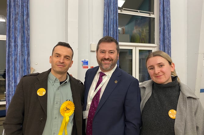 Hossein Pirooz (left) with supporters including Liberal Democrat council leader Kevin Guy (centre)